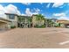 Multi-Gathering residence with stone accents, complemented by mature landscaping, in a paved parking area at 13609 Messina Loop # 104, Bradenton, FL 34211