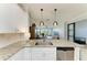 Kitchen featuring stainless steel appliances, a granite countertop, and seamless views into the adjacent living area at 13609 Messina Loop # 104, Bradenton, FL 34211