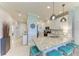Kitchen with granite countertops, stainless steel appliances, breakfast bar seating, and modern pendant lighting at 13609 Messina Loop # 104, Bradenton, FL 34211