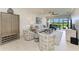 Bright living room with modern decor, stylish furniture, and a view of the screened-in patio at 13609 Messina Loop # 104, Bradenton, FL 34211
