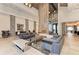 A modern lounge area with sofas, a fireplace, decorative lighting and elegant furnishings at 13609 Messina Loop # 104, Bradenton, FL 34211