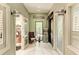 Hallway in a spa with a sitting area featuring decorative glass doors for the salon and office at 13609 Messina Loop # 104, Bradenton, FL 34211