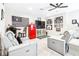 Bonus room decorated with sports memorabilia, wet bar, and comfy seating at 13871 Heartwood Way, Parrish, FL 34219