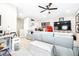 Bonus room decorated with sports memorabilia, wet bar, and comfy seating at 13871 Heartwood Way, Parrish, FL 34219