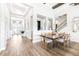 Light and bright dining area, features wood floors, access to entryway and staircase at 13871 Heartwood Way, Parrish, FL 34219