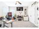 Home office area with built-in fireplace, desk, and TV at 13871 Heartwood Way, Parrish, FL 34219