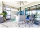Outdoor kitchen with granite countertops, stainless steel grill, bar seating, and tile backsplash at 13871 Heartwood Way, Parrish, FL 34219