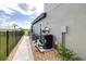 Exterior view of the home's utility systems including air conditioning and pool equipment at 13871 Heartwood Way, Parrish, FL 34219