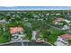 Aerial view of lush backyard leading to the private boat dock and canal at 1808 Coquina Dr, Sarasota, FL 34231