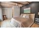 Spacious bedroom boasts vaulted wood ceilings, neutral decor, and ample natural light at 1808 Coquina Dr, Sarasota, FL 34231