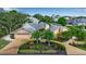 Well-maintained home featuring manicured landscaping, a spacious driveway, and an attached two-car garage at 1808 Coquina Dr, Sarasota, FL 34231