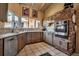 Bright kitchen with stainless appliances, granite countertops, and ample cabinetry at 1808 Coquina Dr, Sarasota, FL 34231