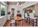 Cozy kitchen nook with brick-laid floors and view into kitchen at 1808 Coquina Dr, Sarasota, FL 34231