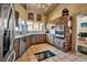 Charming kitchen boasts stainless steel appliances, brick accents, and bright lighting at 1808 Coquina Dr, Sarasota, FL 34231