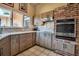 Modern kitchen featuring stainless appliances, ample cabinetry, and natural light at 1808 Coquina Dr, Sarasota, FL 34231