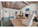 Warm and inviting living room with a fireplace, vaulted ceilings, unique floor tiles, and neutral furniture at 1808 Coquina Dr, Sarasota, FL 34231
