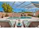 Enclosed pool area with lounge chairs, lush landscaping, and clear blue water at 1808 Coquina Dr, Sarasota, FL 34231