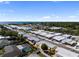 Panoramic aerial view of the neighborhood showcasing the abundance of homes and water views at 2107 Palma Sola Blvd # 7, Bradenton, FL 34209