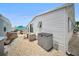 Outdoor side yard with patio and shed and a partial view of the community at 2107 Palma Sola Blvd # 7, Bradenton, FL 34209