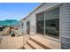 Backyard patio with stone and outdoor seating, with shade umbrella at 2107 Palma Sola Blvd # 7, Bradenton, FL 34209