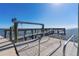 Dock featuring a boat lift for easy access to waterfront adventures at 2107 Palma Sola Blvd # 7, Bradenton, FL 34209