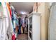 Walk-in closet featuring ample storage, shelving, and hanging space for organized clothing and accessories at 2107 Palma Sola Blvd # 7, Bradenton, FL 34209