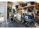 Organized garage featuring ample storage shelving, a utility sink, and a washing machine at 2107 Palma Sola Blvd # 7, Bradenton, FL 34209