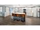 Modern kitchen with an island and bar stools, providing a seamless flow to adjacent rooms at 2107 Palma Sola Blvd # 7, Bradenton, FL 34209