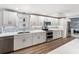 Bright kitchen with white cabinets, stainless steel appliances, and stylish backsplash at 2107 Palma Sola Blvd # 7, Bradenton, FL 34209