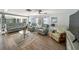 Comfortable living room with plush seating, ceiling fan, and large windows at 2107 Palma Sola Blvd # 7, Bradenton, FL 34209