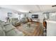 Relaxing living room with comfortable seating, a ceiling fan, and a TV at 2107 Palma Sola Blvd # 7, Bradenton, FL 34209