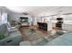 Open concept living space with a modern kitchen and comfortable seating area at 2107 Palma Sola Blvd # 7, Bradenton, FL 34209
