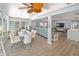 Open-concept living space connecting a dining area and living room at 2107 Palma Sola Blvd # 7, Bradenton, FL 34209