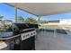 Covered patio features a grill and outdoor space at 2107 Palma Sola Blvd # 7, Bradenton, FL 34209