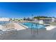 Relax poolside on lounge chairs, enjoying views of the surrounding community at 2107 Palma Sola Blvd # 7, Bradenton, FL 34209