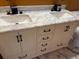 Bathroom vanity with a marble countertop, double sinks, and ample storage space at 2311 W 52Nd Ave Drive, Bradenton, FL 34207