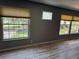 Bright interior room featuring plank floors, neutral walls and two windows at 2311 W 52Nd Ave Drive, Bradenton, FL 34207