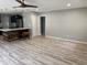 Spacious living area featuring plank floors and an open layout with access to the kitchen at 2311 W 52Nd Ave Drive, Bradenton, FL 34207