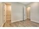 Spacious bedroom with modern wood-look flooring and walk-in closets for ample storage at 2469 Paradise Plum Dr, Sarasota, FL 34240