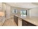 Spacious kitchen with a large island, quartz countertops, and views of the backyard at 2469 Paradise Plum Dr, Sarasota, FL 34240