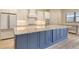 Close up of kitchen featuring a large island and stainless appliances at 2469 Paradise Plum Dr, Sarasota, FL 34240