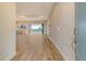 Bright living room with tile flooring, recessed lighting, and sliding glass doors leading to a pool at 2469 Paradise Plum Dr, Sarasota, FL 34240