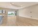 Bright living room with tile flooring, recessed lighting, and sliding glass doors leading to a pool at 2469 Paradise Plum Dr, Sarasota, FL 34240