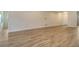 Large living room featuring wood-look tile and a neutral paint scheme at 2469 Paradise Plum Dr, Sarasota, FL 34240