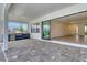Covered outdoor patio with a built-in grill, a view of the pool and an open concept to the interior at 2469 Paradise Plum Dr, Sarasota, FL 34240