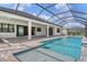 A spacious pool area features clear blue water and screened-in enclosure at 2469 Paradise Plum Dr, Sarasota, FL 34240