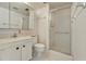 Bathroom with bright lighting, functional shower and vanity with storage at 2727 75Th W St # 1Af, Bradenton, FL 34209