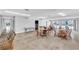 Spacious clubhouse area with tables, chairs, and views of the pool at 2727 75Th W St # 1Af, Bradenton, FL 34209