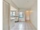 Open kitchen featuring white cabinets, a tile floor and a kitchen view through the window at 2727 75Th W St # 1Af, Bradenton, FL 34209
