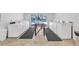 Bright laundry room with multiple washing machines and folding area at 2727 75Th W St # 1Af, Bradenton, FL 34209